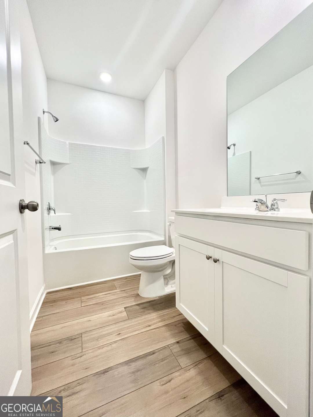 1529 Haypatch Lane Loganville, GA 30052 - Photo 7 of 24 a bathroom with a sink a toilet and a large mirror