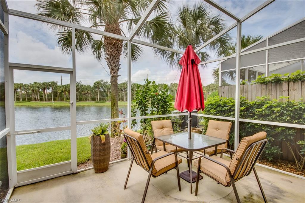 16211 Ravina Way, Unit 18 Naples, FL 34110 - Photo 22 of 25 a view of a chairs and table in the patio