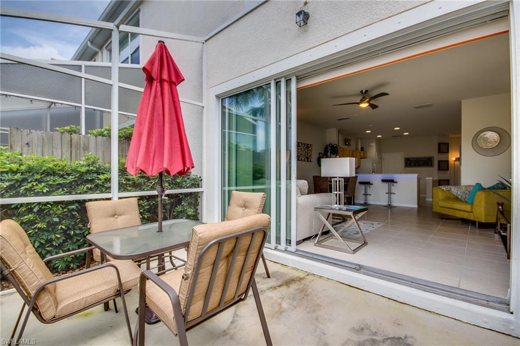 16211 Ravina Way, Unit 18 Naples, FL 34110 - Photo 23 of 25 a view of a dining room and furniture