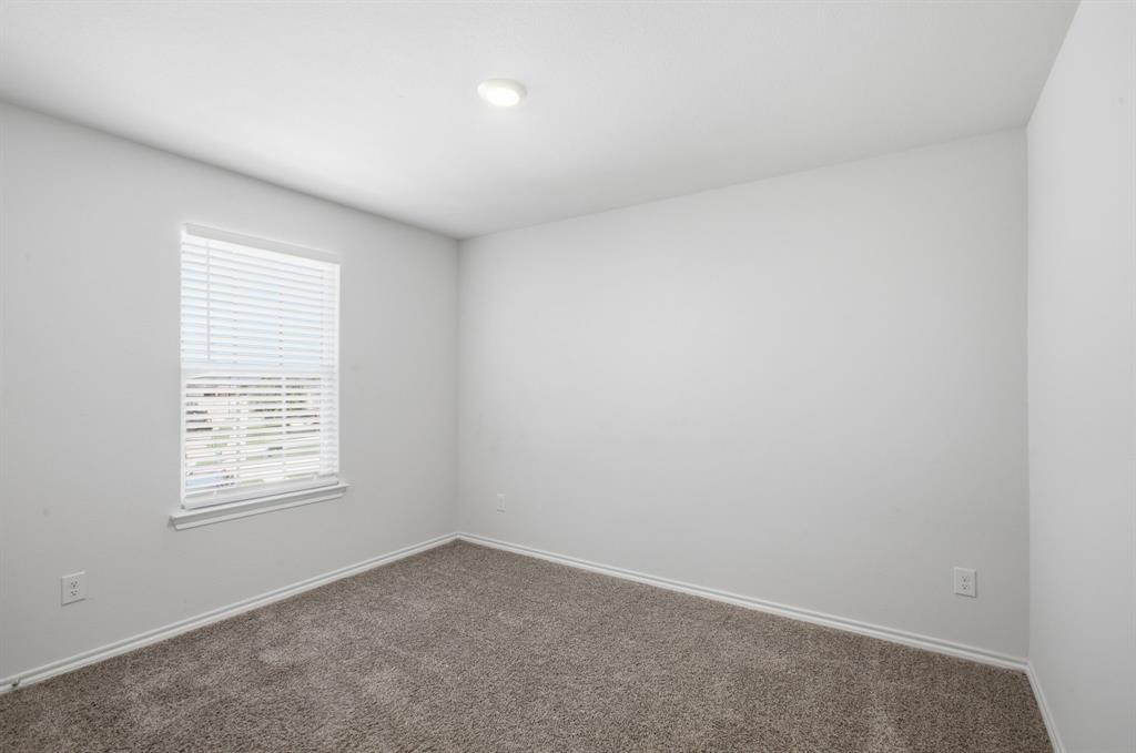 1328 Broaddus Road Forney, TX 75126 - Photo 26 of 31 Carpeted room with a recessed ceiling light, baseboard trim, and a window with blinds