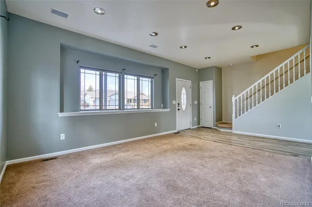 a view of an empty room with a window