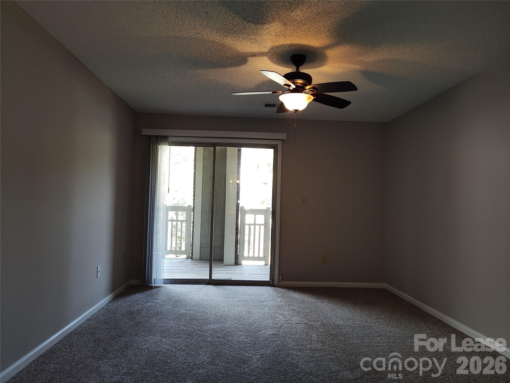 5001 Sharon Road, Unit K Charlotte, NC 28210 - Photo 21 of 24 a view of an empty room with a window