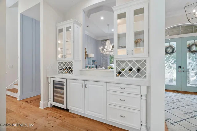 a living room with furniture kitchen and a fireplace