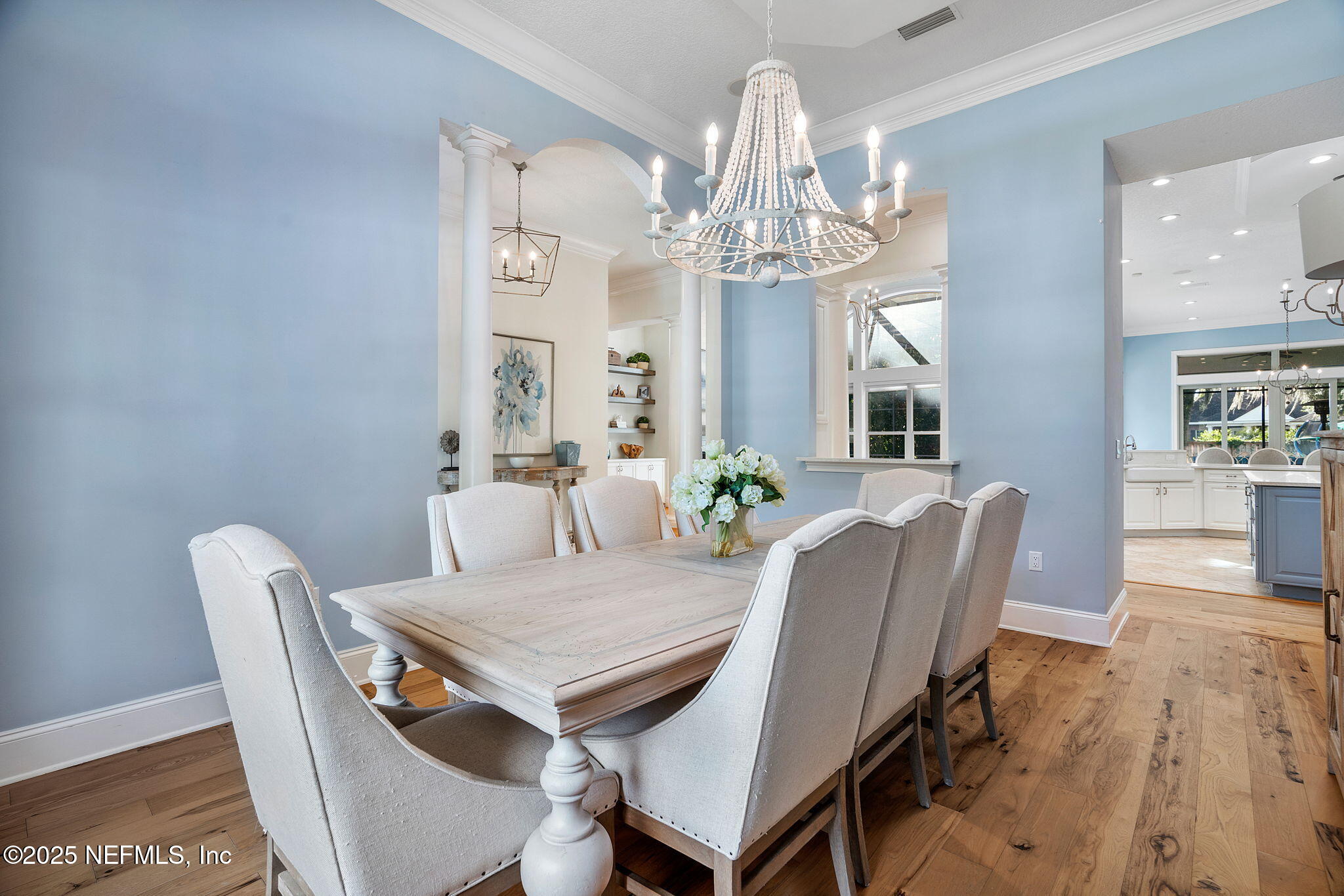 1141 Popolee Road St. Johns, FL 32259 - Photo 12 of 79 a view of a dining room with furniture a chandelier and wooden floor