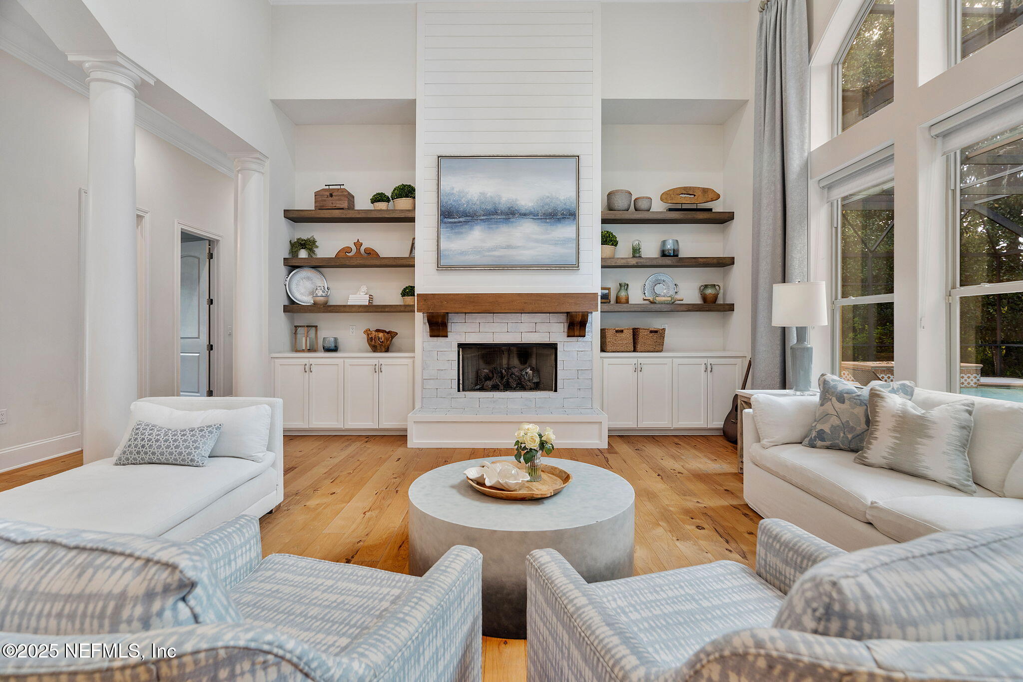 1141 Popolee Road St. Johns, FL 32259 - Photo 15 of 79 a living room with furniture kitchen and a fireplace