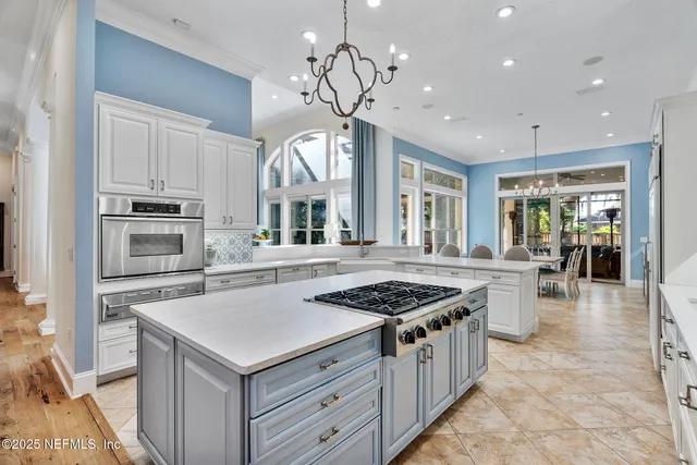 a stove top oven sitting inside of a kitchen