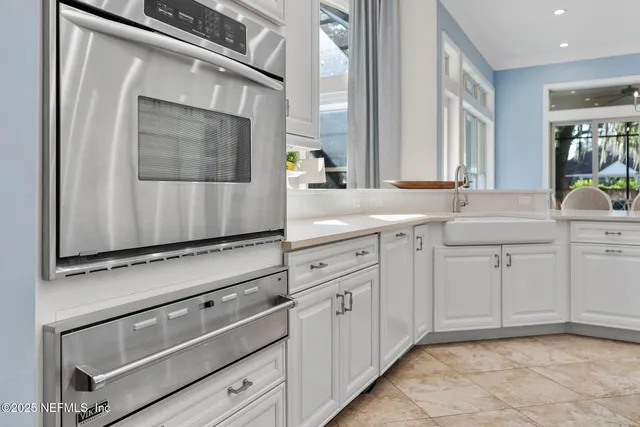 a bedroom with a bed and a table chair