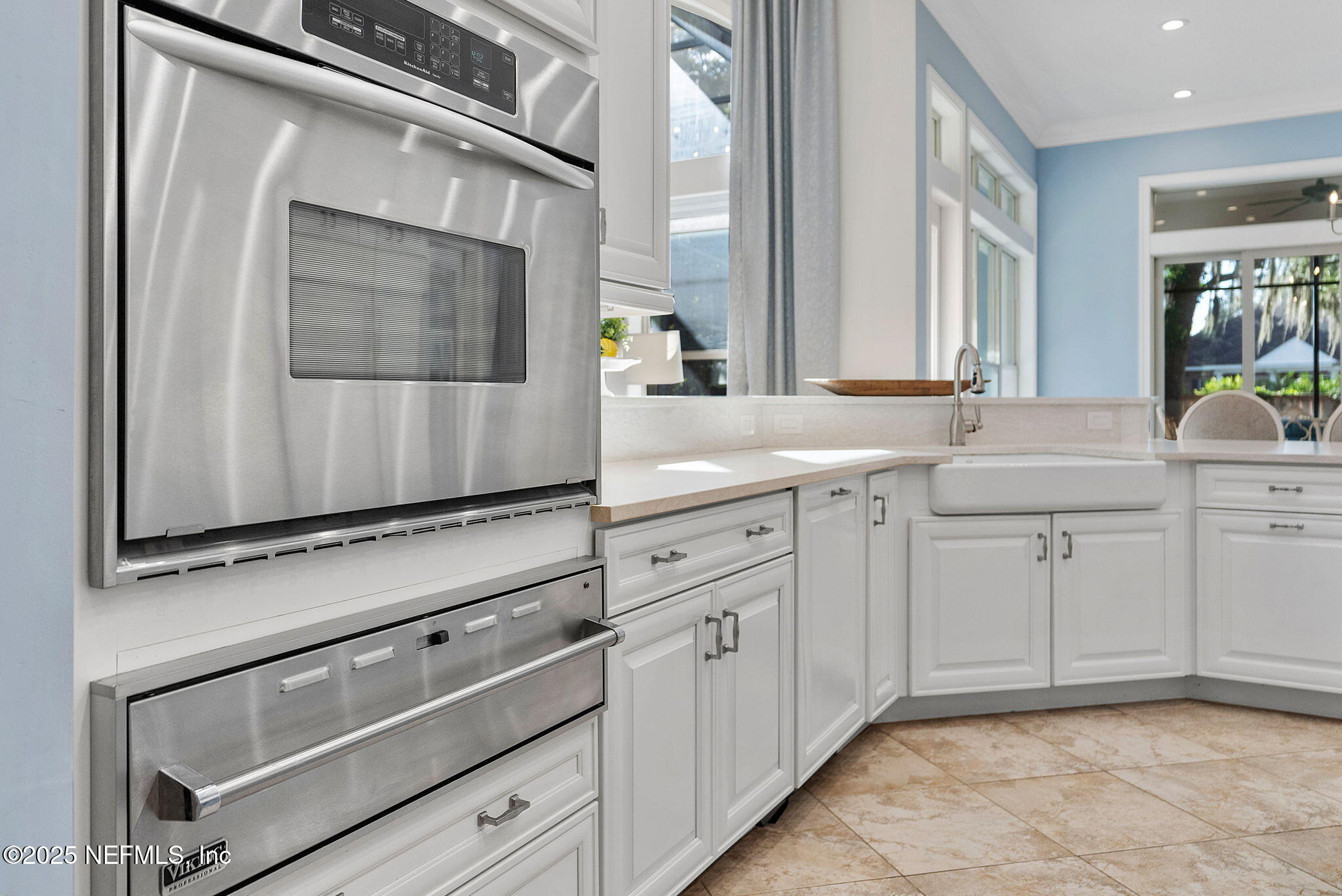 1141 Popolee Road St. Johns, FL 32259 - Photo 19 of 79 a kitchen with white cabinets and sink