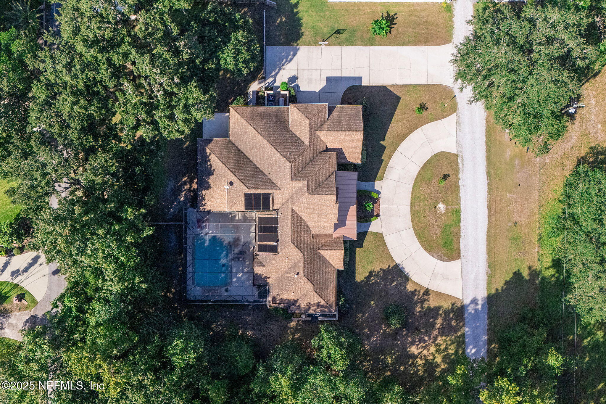 1141 Popolee Road St. Johns, FL 32259 - Photo 2 of 79 an aerial view of a house with swimming pool and trees