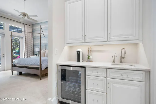 a spacious bedroom with a bed and a couch