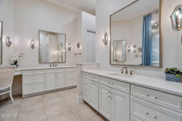 a bathroom with a sink a vanity and a mirror