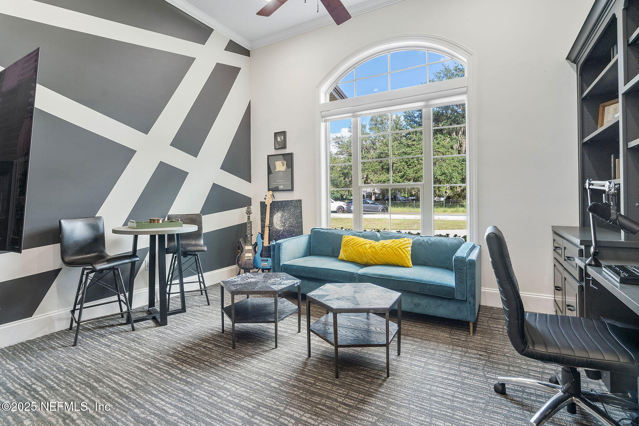 1141 Popolee Road St. Johns, FL 32259 - Photo 40 of 79 a living room with furniture and a floor to ceiling window