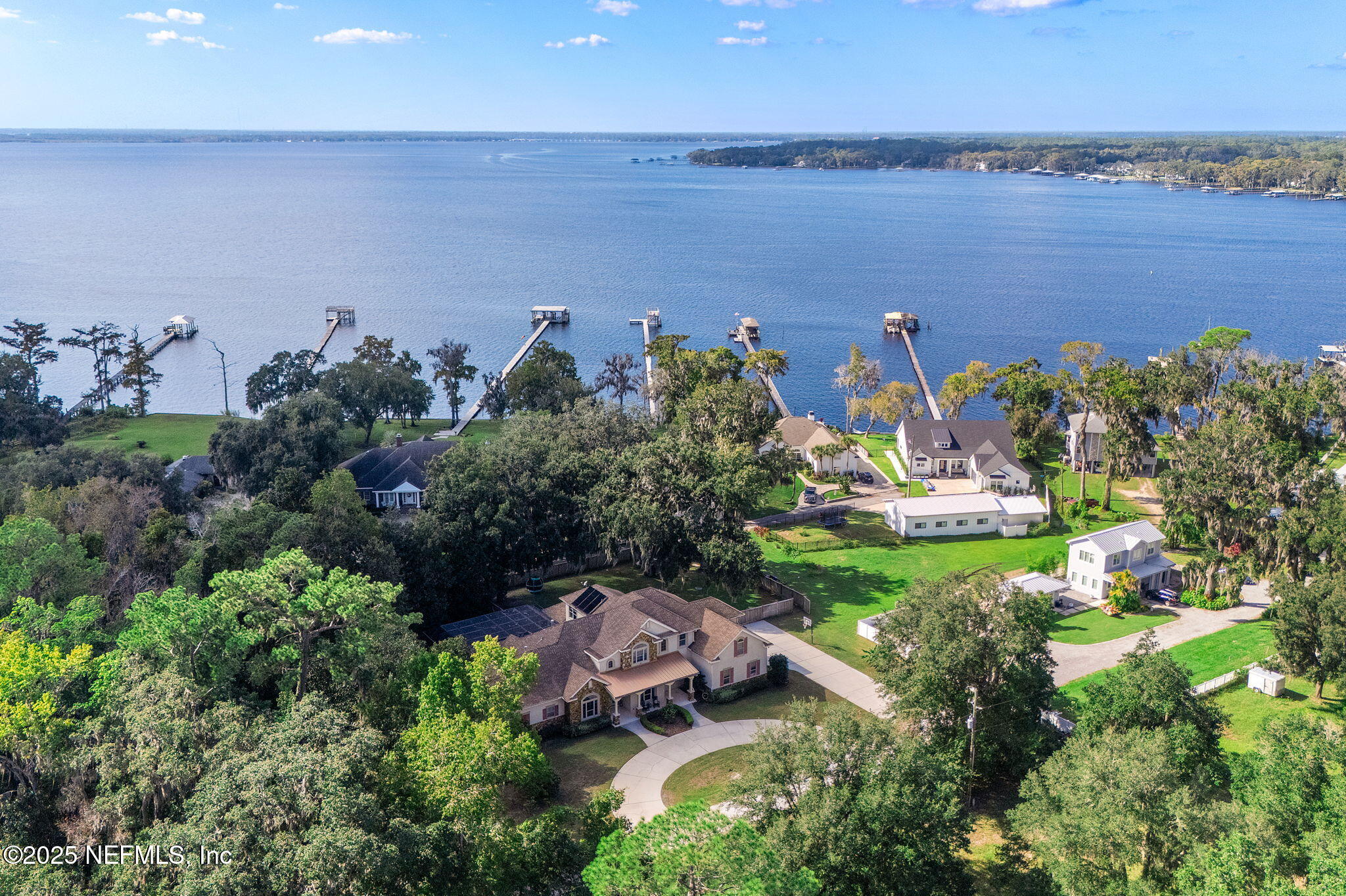 1141 Popolee Road St. Johns, FL 32259 - Photo 4 of 79 an aerial view of a house with a garden and lake view