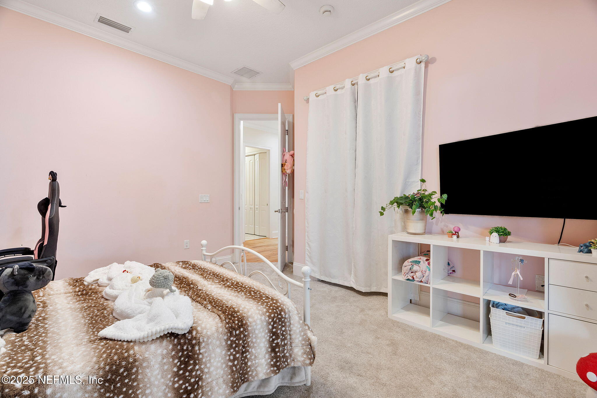 1141 Popolee Road St. Johns, FL 32259 - Photo 44 of 79 a bedroom with a bed and a flat screen tv