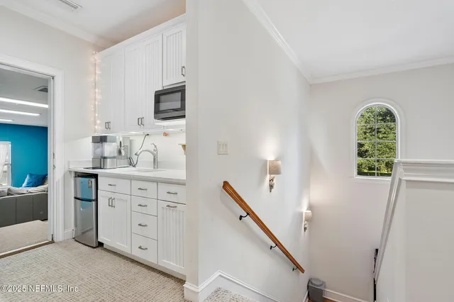 a view of a backyard with a slide and a large tree