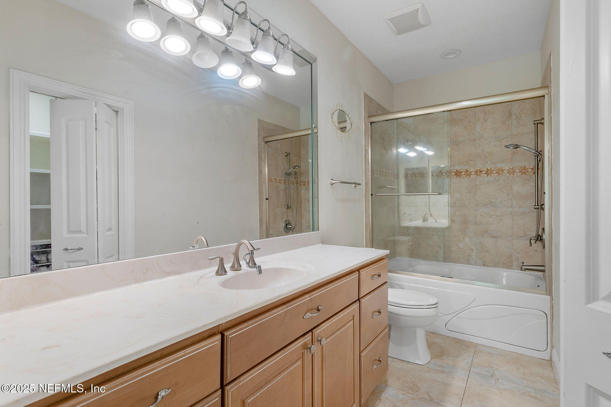 1141 Popolee Road St. Johns, FL 32259 - Photo 48 of 79 a bathroom with a sink a toilet and shower