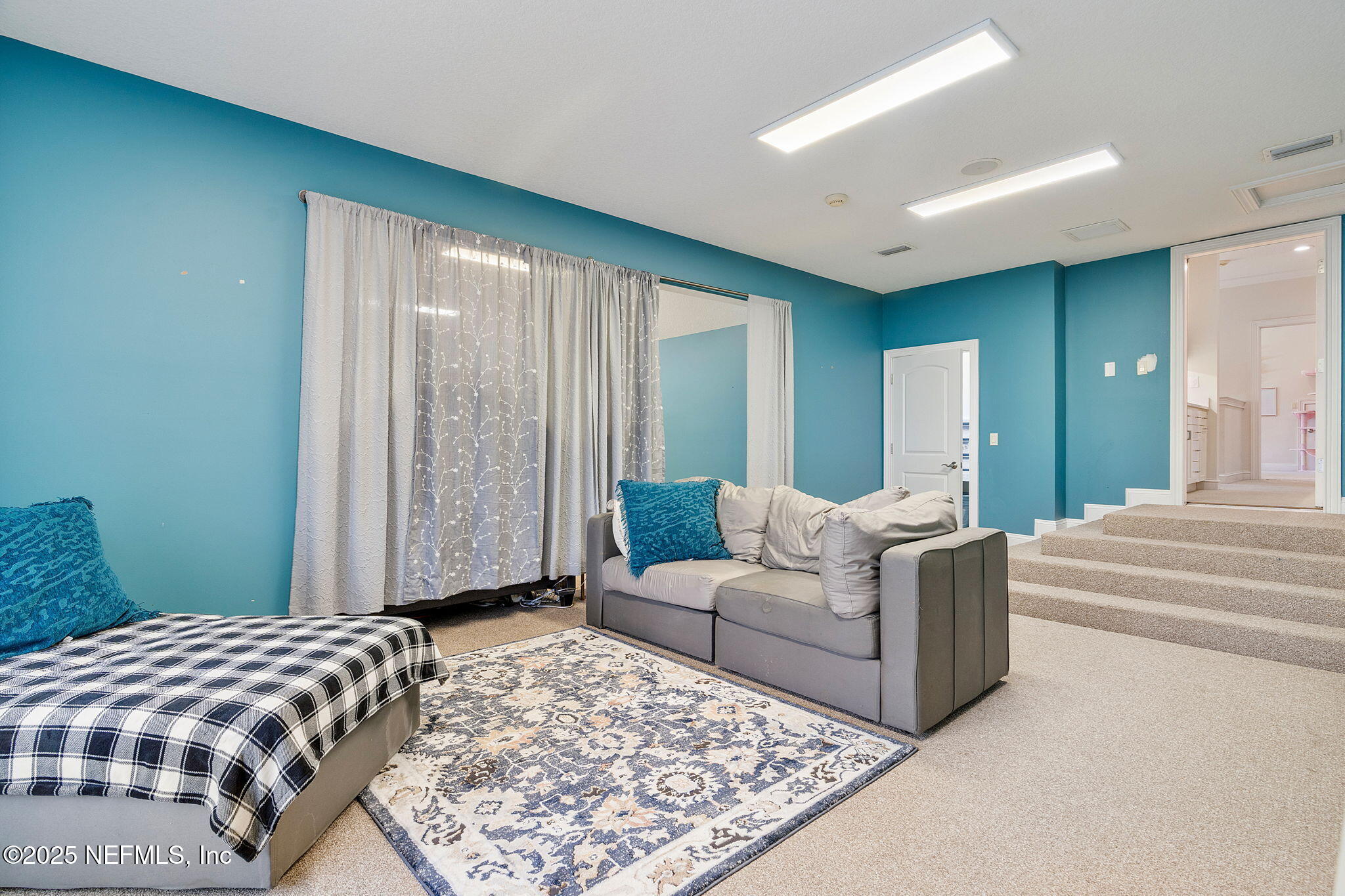 1141 Popolee Road St. Johns, FL 32259 - Photo 54 of 79 a living room with a couch and a rug