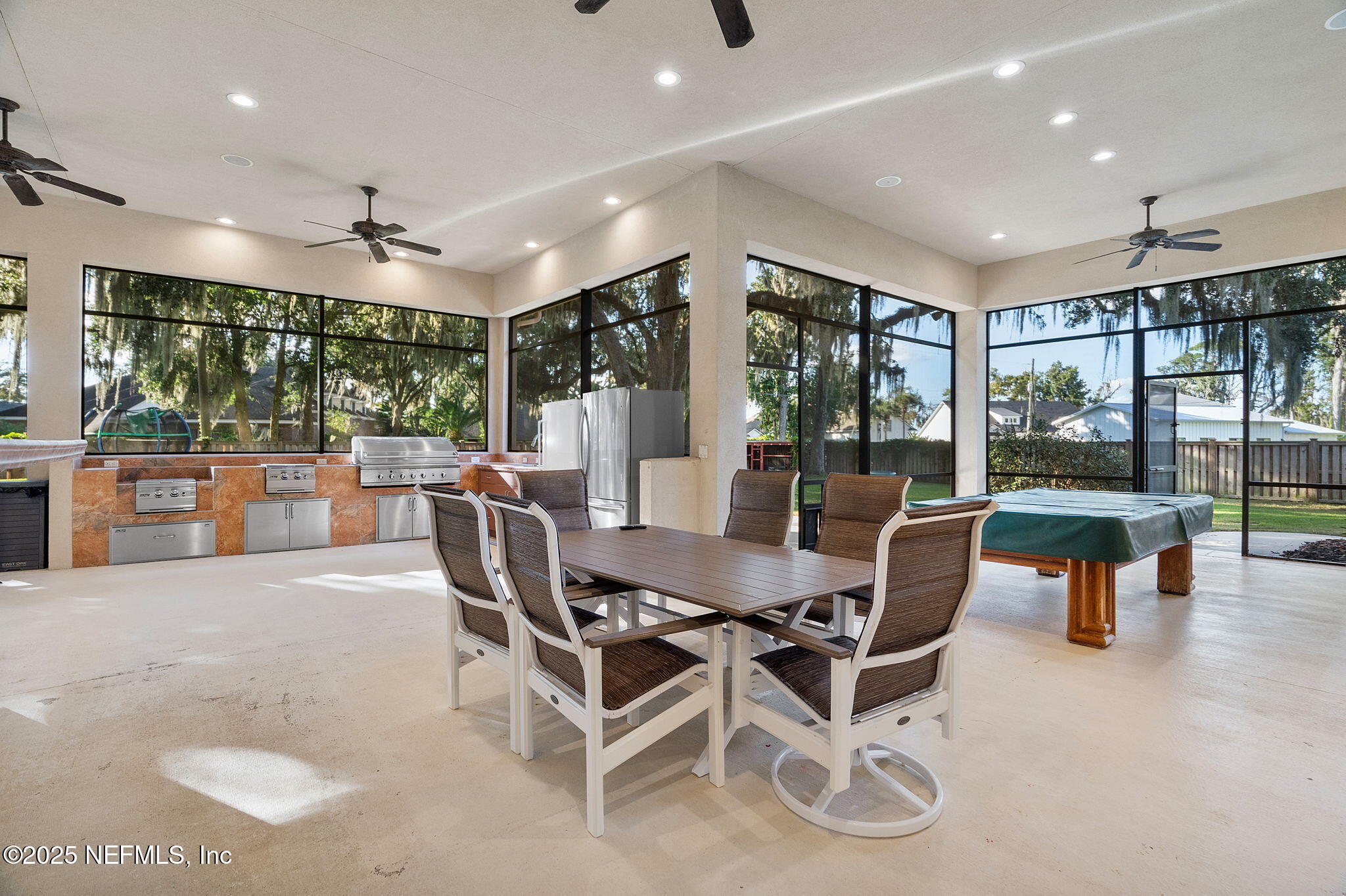 1141 Popolee Road St. Johns, FL 32259 - Photo 71 of 79 a dining room with furniture and a floor to ceiling window