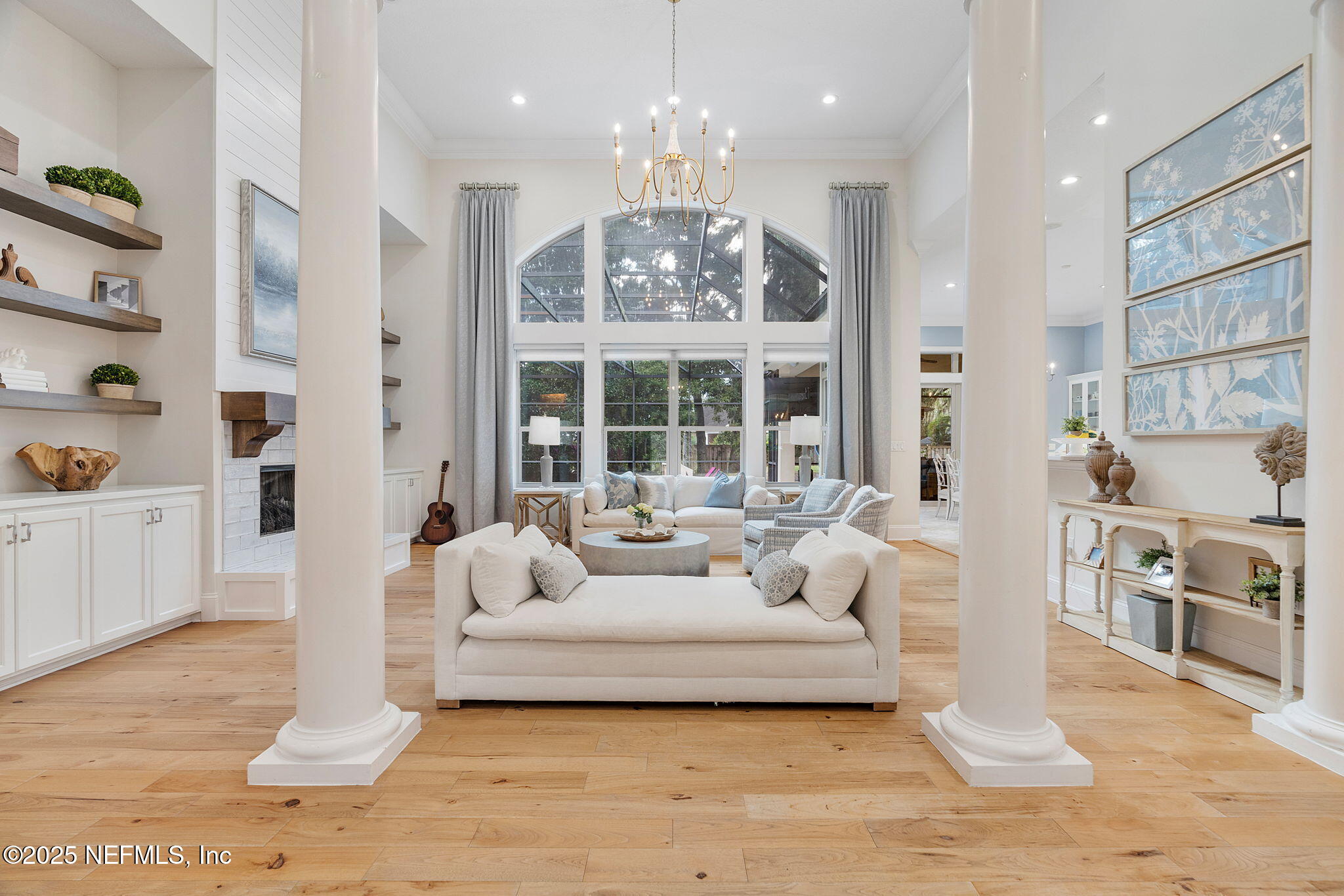 1141 Popolee Road St. Johns, FL 32259 - Photo 10 of 79 a living room with furniture and a chandelier