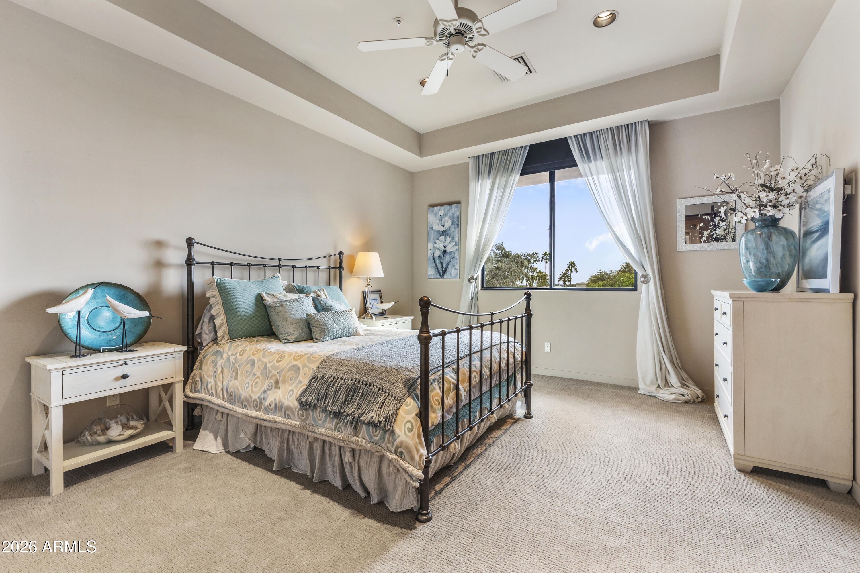 6109 North Palo Cristi Road Paradise Valley, AZ 85253 - Photo 29 of 76 a bedroom with a bed and a chandelier