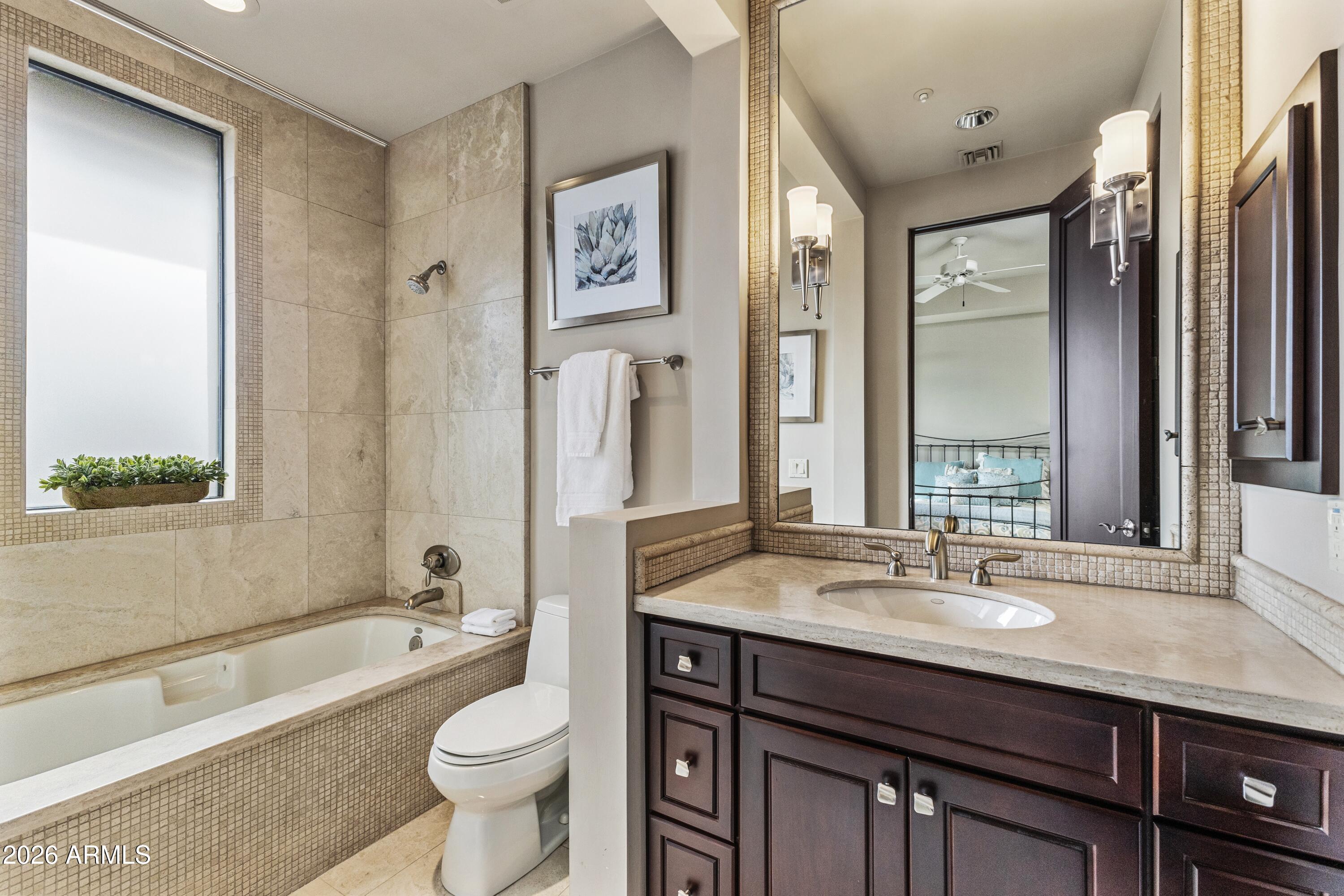 6109 North Palo Cristi Road Paradise Valley, AZ 85253 - Photo 30 of 76 a bathroom with a granite countertop sink toilet and shower
