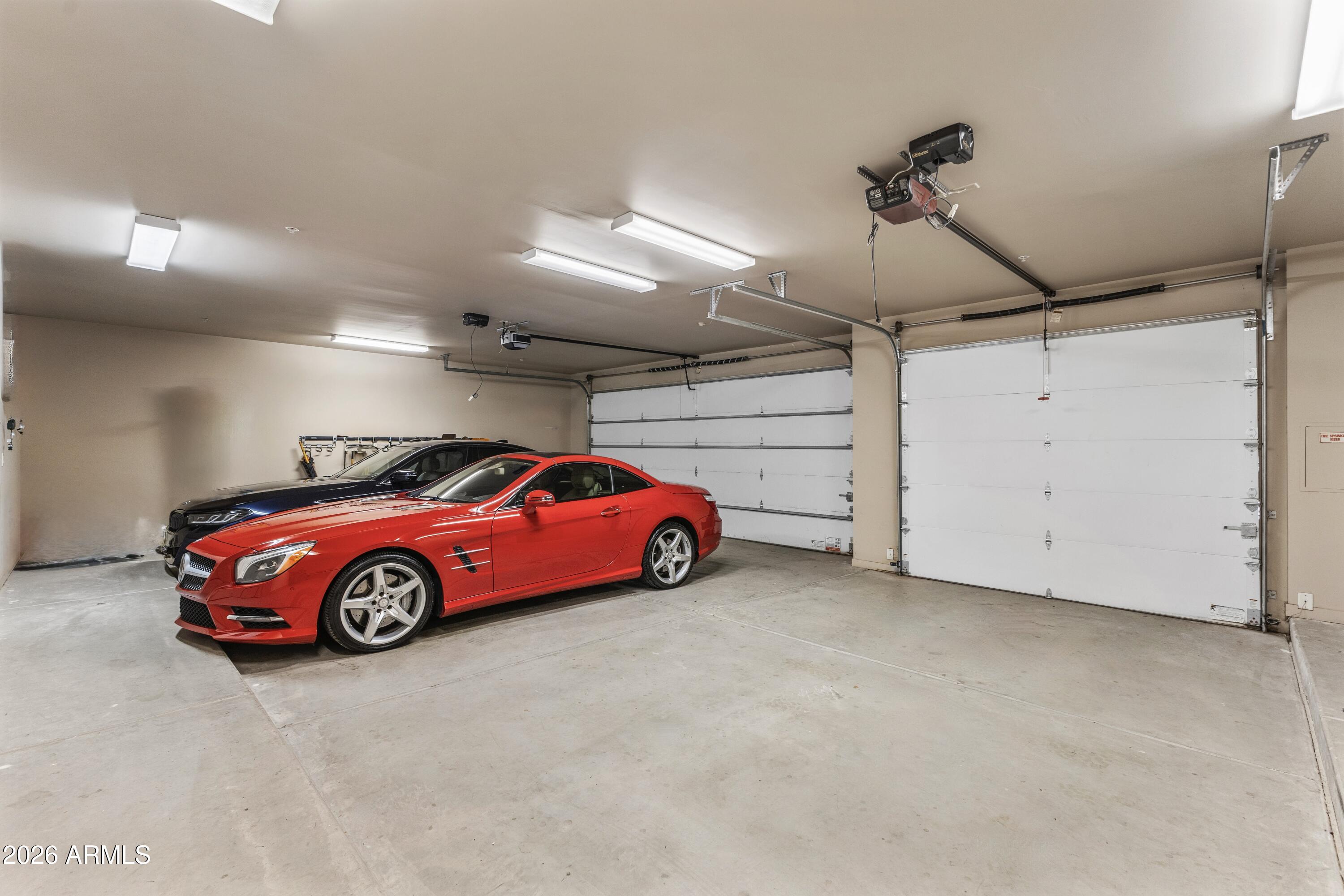 6109 North Palo Cristi Road Paradise Valley, AZ 85253 - Photo 39 of 76 a car is parked in a garage