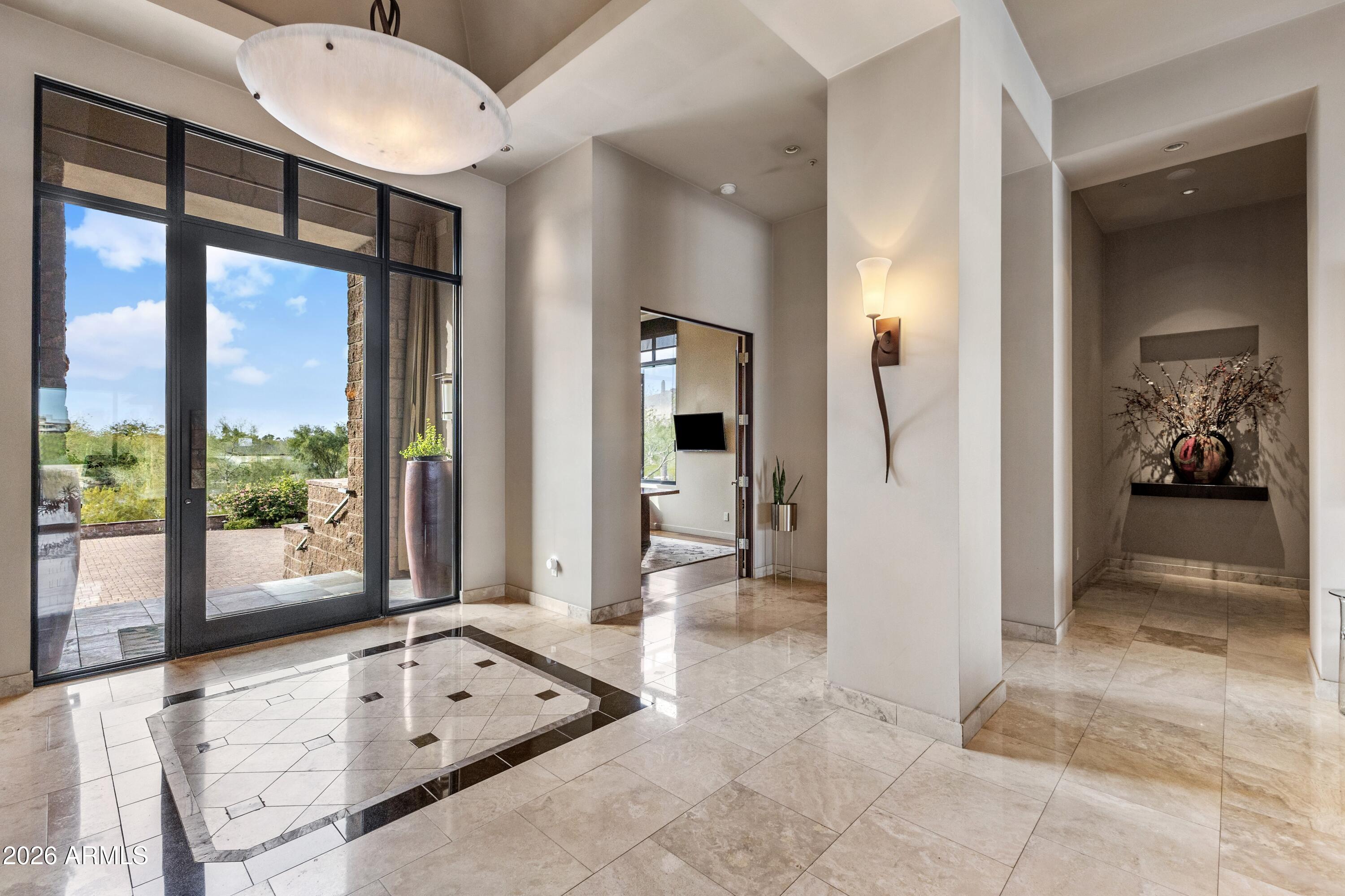 6109 North Palo Cristi Road Paradise Valley, AZ 85253 - Photo 5 of 76 a view of a hallway with furniture and windows