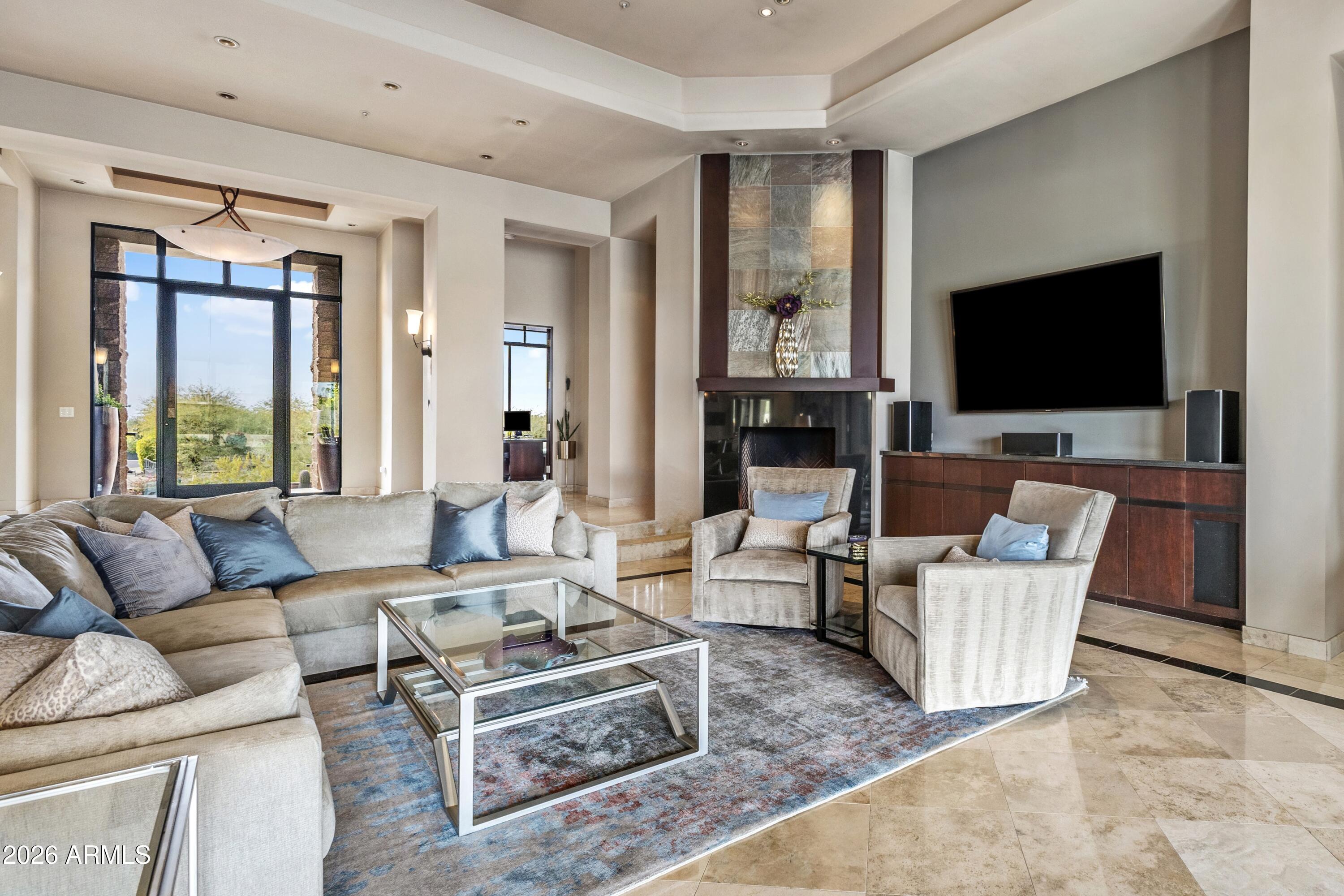 6109 North Palo Cristi Road Paradise Valley, AZ 85253 - Photo 6 of 76 a living room with furniture and a flat screen tv