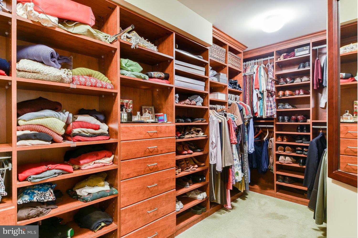 1500 Grace Church Road Silver Spring, MD 20910 - Photo 18 of 30 a view of walk in closet with clothes and shoes