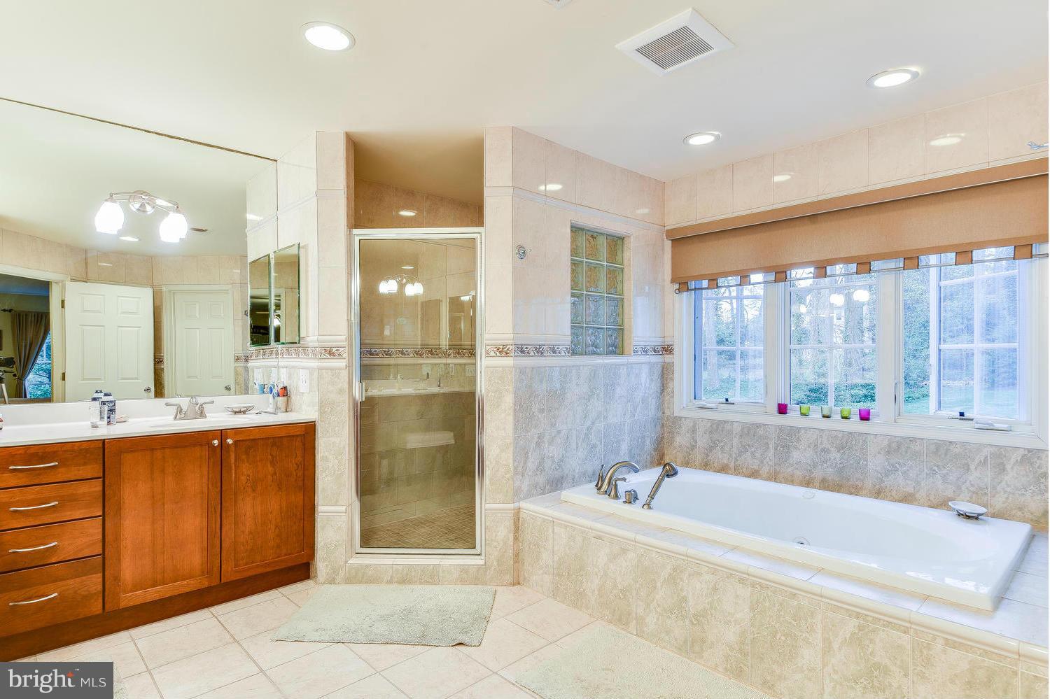 1500 Grace Church Road Silver Spring, MD 20910 - Photo 20 of 30 a bathroom with a large tub shower and sink