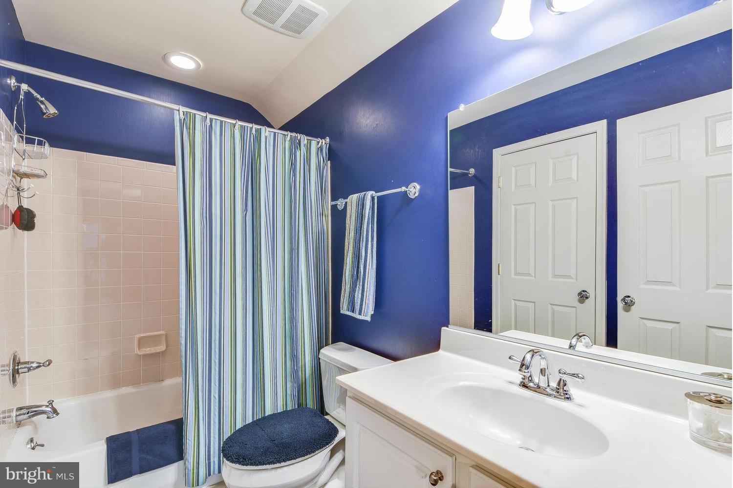 1500 Grace Church Road Silver Spring, MD 20910 - Photo 25 of 30 a bathroom with a granite countertop sink a toilet and shower