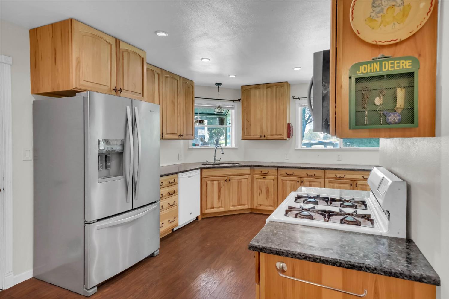 39640 South River Road Clarksburg, CA 95612 - Photo 10 of 25 a kitchen with granite countertop a refrigerator stove and sink