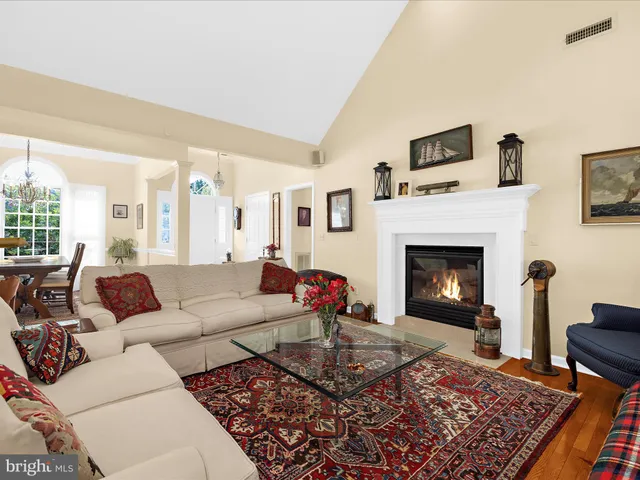 a kitchen with a sink a stove top oven and white cabinets