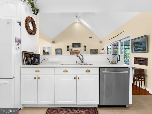 a bedroom with a bed and glass window