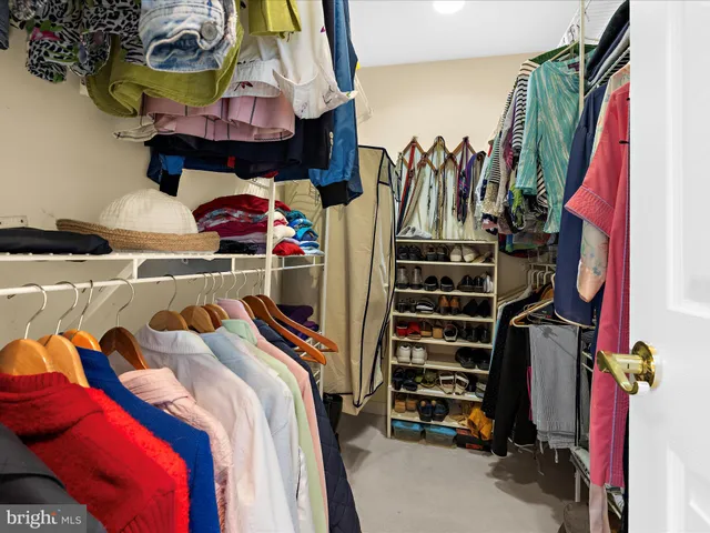 a bedroom with bed and a window