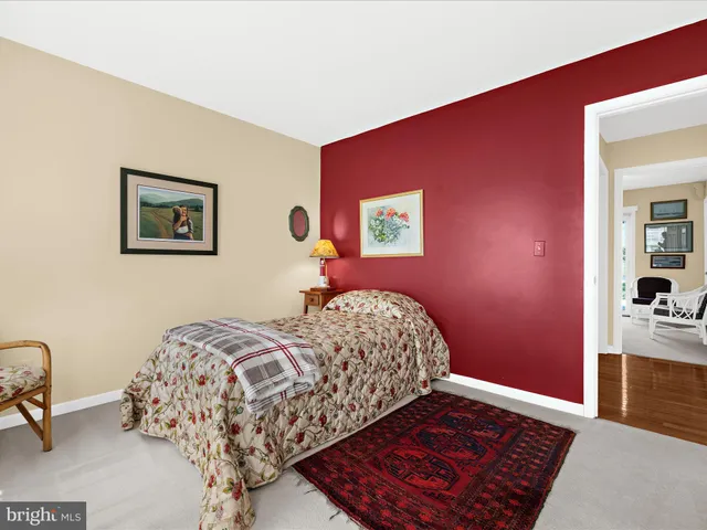 a living room with furniture ceiling fan and a window