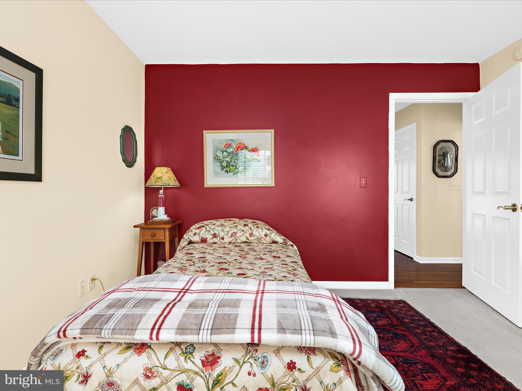 8698 Cummings Road Wittman, MD 21676 - Photo 29 of 63 a bedroom with a bed and a painting on the wall