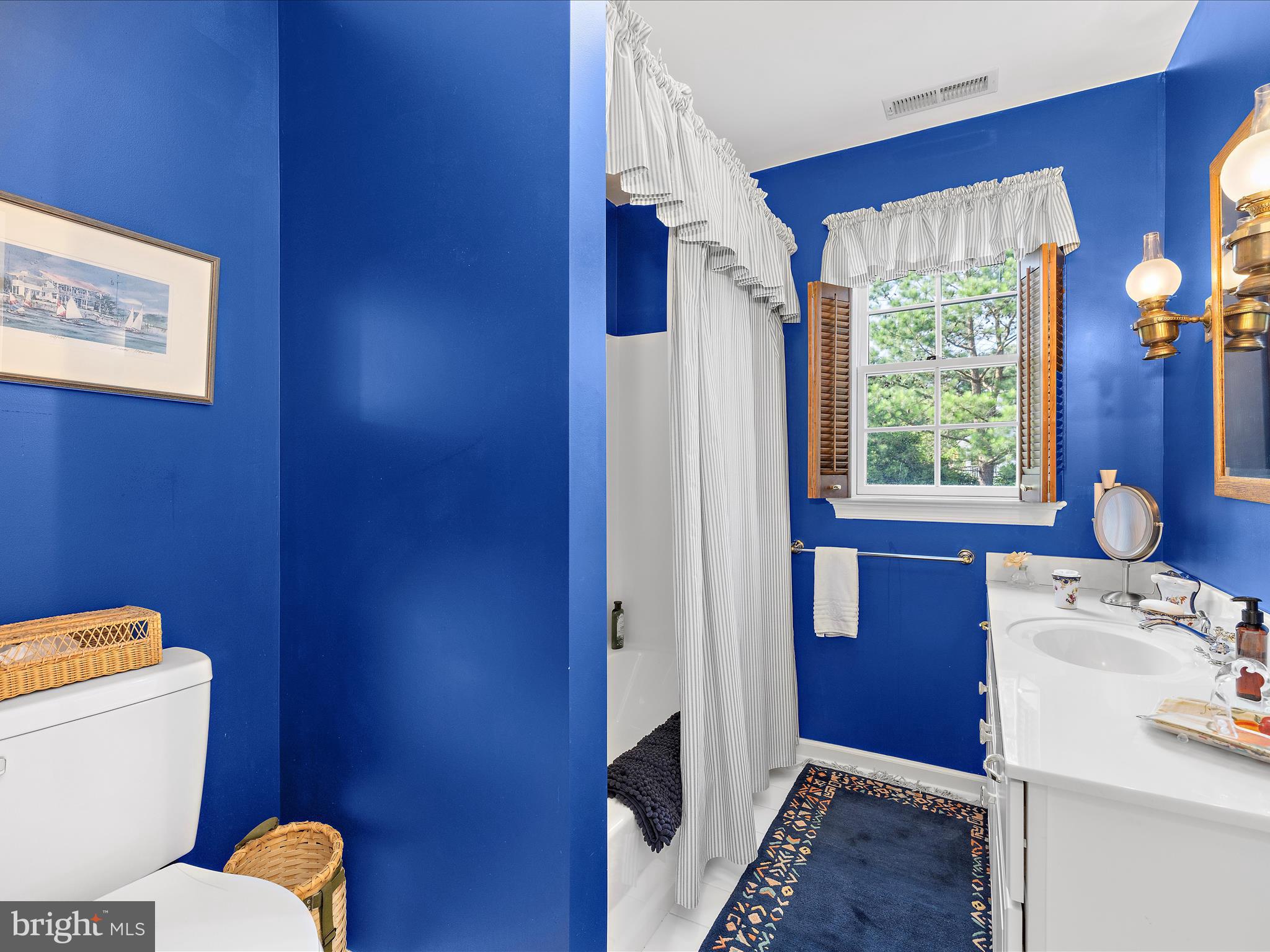 8698 Cummings Road Wittman, MD 21676 - Photo 31 of 63 a bathroom with a toilet sink and mirror