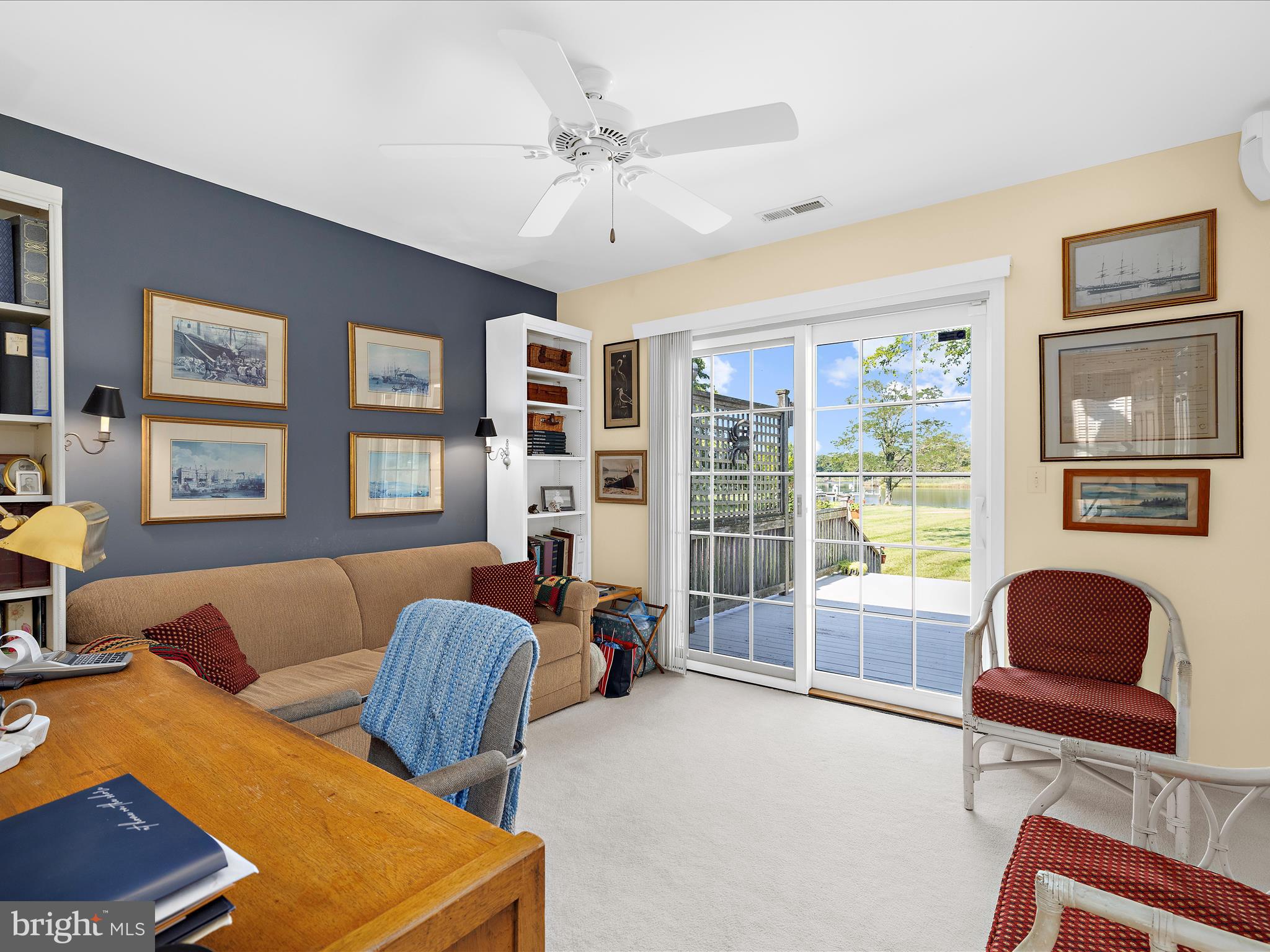 8698 Cummings Road Wittman, MD 21676 - Photo 32 of 63 a living room with furniture ceiling fan and a window