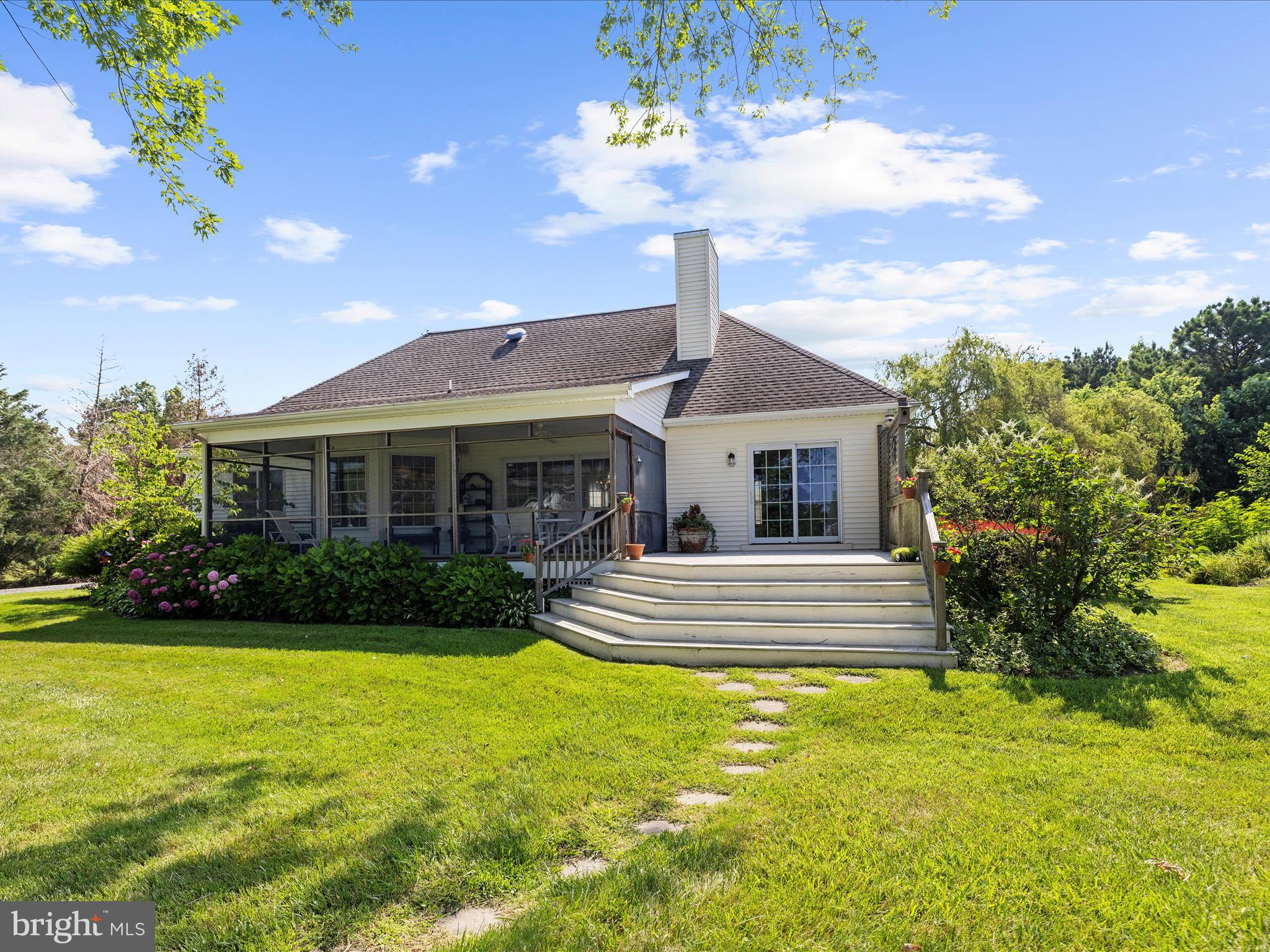 8698 Cummings Road Wittman, MD 21676 - Photo 41 of 63 a front view of a house with garden and patio