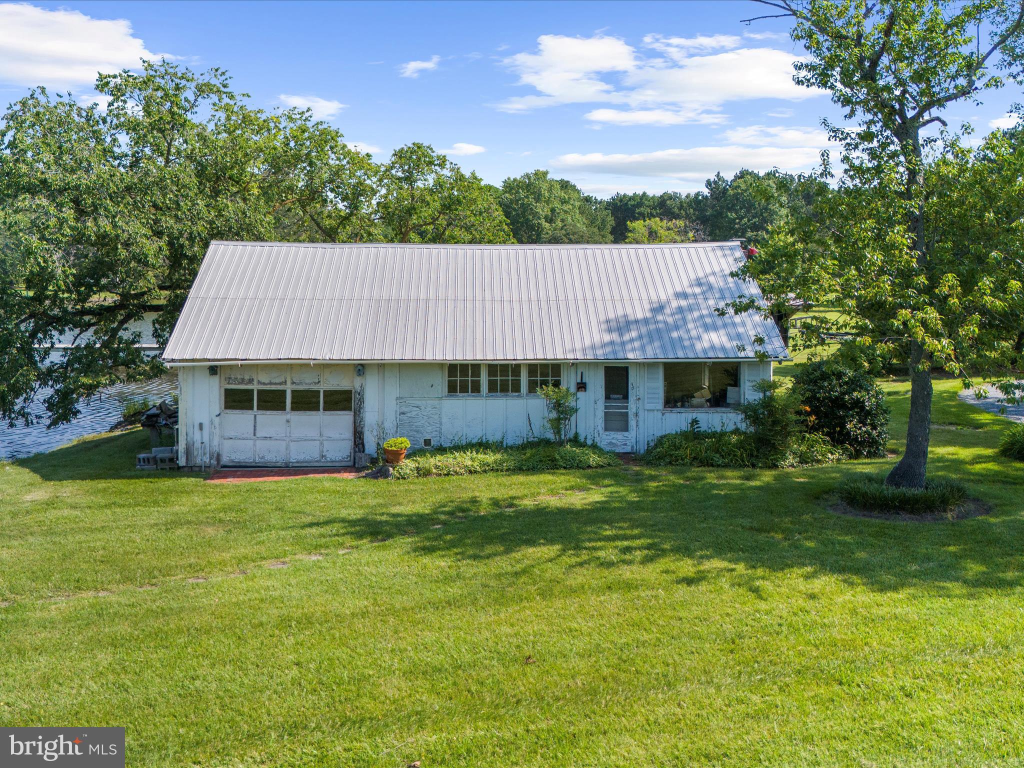 8698 Cummings Road Wittman, MD 21676 - Photo 42 of 63 a view of a house with a yard