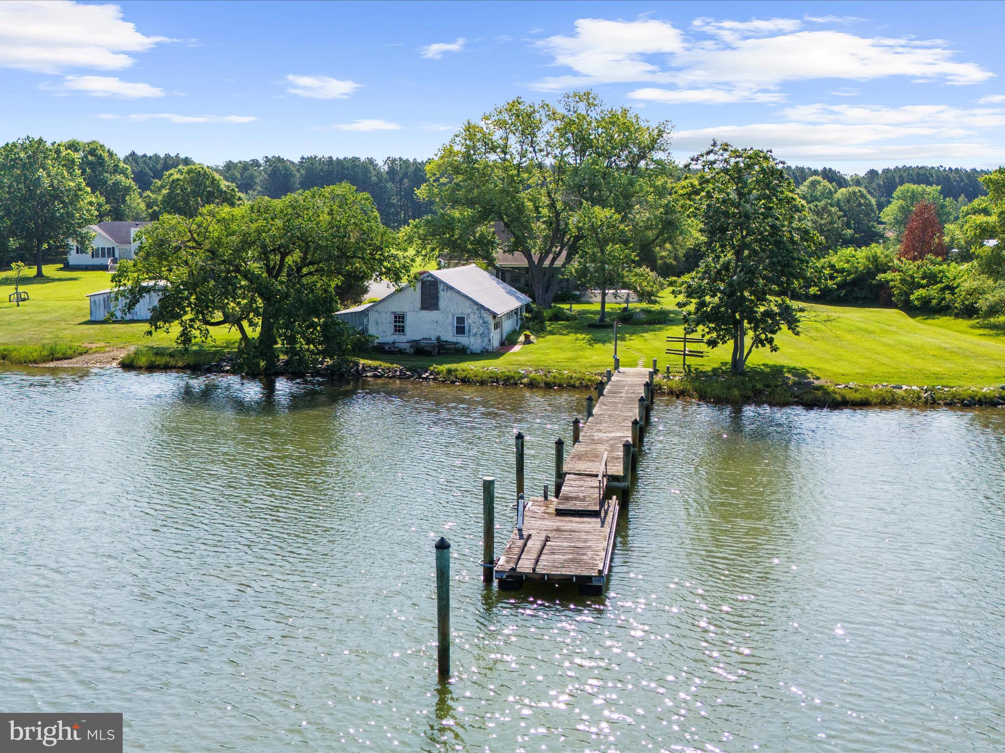 8698 Cummings Road Wittman, MD 21676 - Photo 49 of 63 an aerial view of a house with swimming pool and lake view