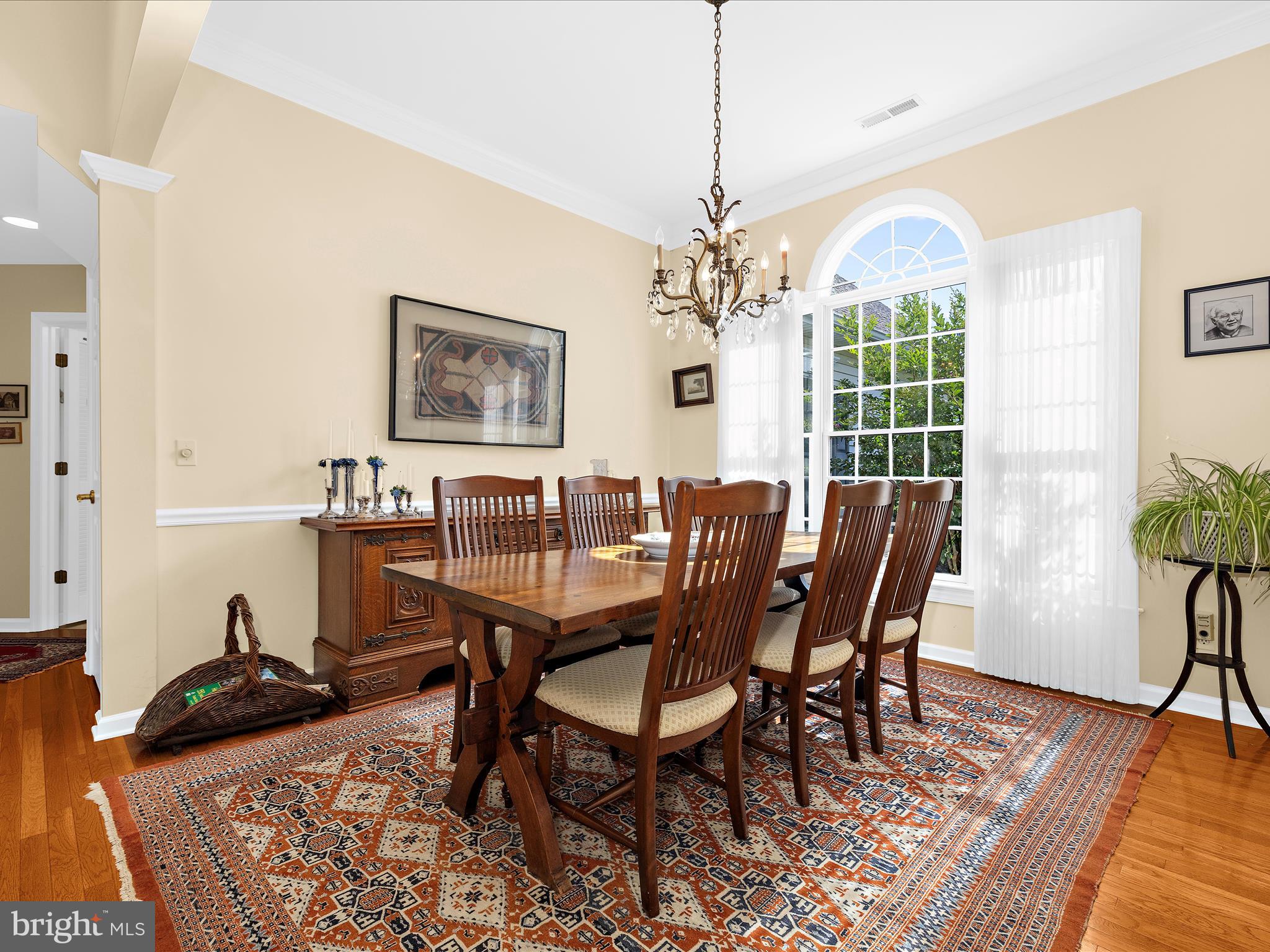 8698 Cummings Road Wittman, MD 21676 - Photo 8 of 63 a view of a dining room with furniture window and wooden floor