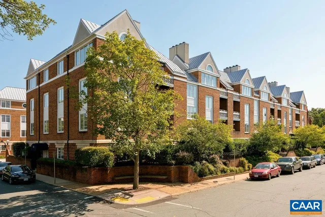 a view of multiple houses with a street