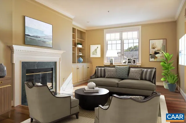 a living room with furniture and a fireplace