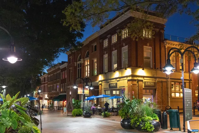 a group of people sitting outside of a city