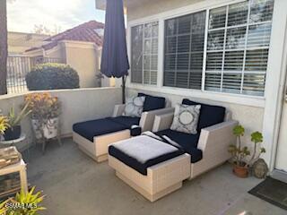 4240 Lost Hills Road, Unit 2901 Calabasas, CA 91301 - Photo 7 of 15 a view of a patio with couches and a potted plant on a table
