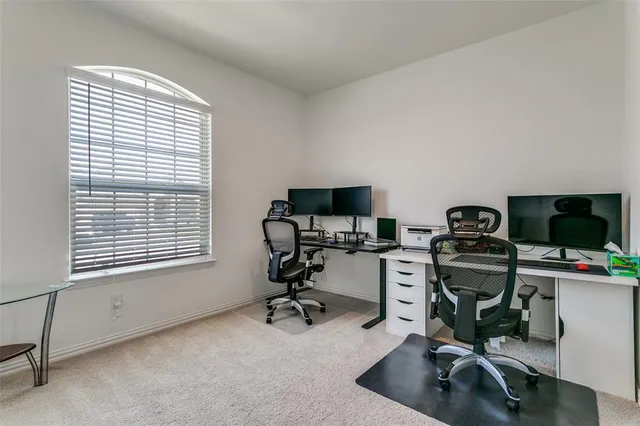 a bedroom with a bed couch and a window