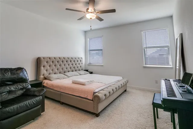 a bedroom with bed and window