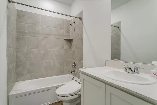 a bedroom with a bed and a chair